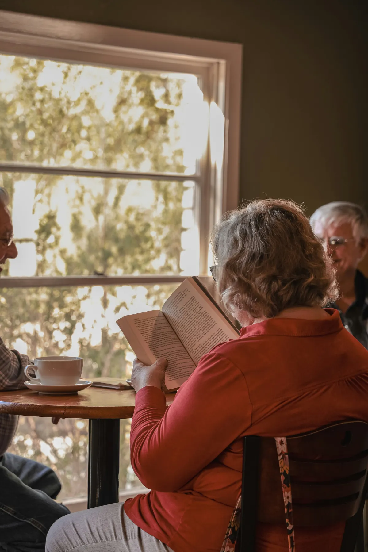 elderly folks, reading and enjoying their day together